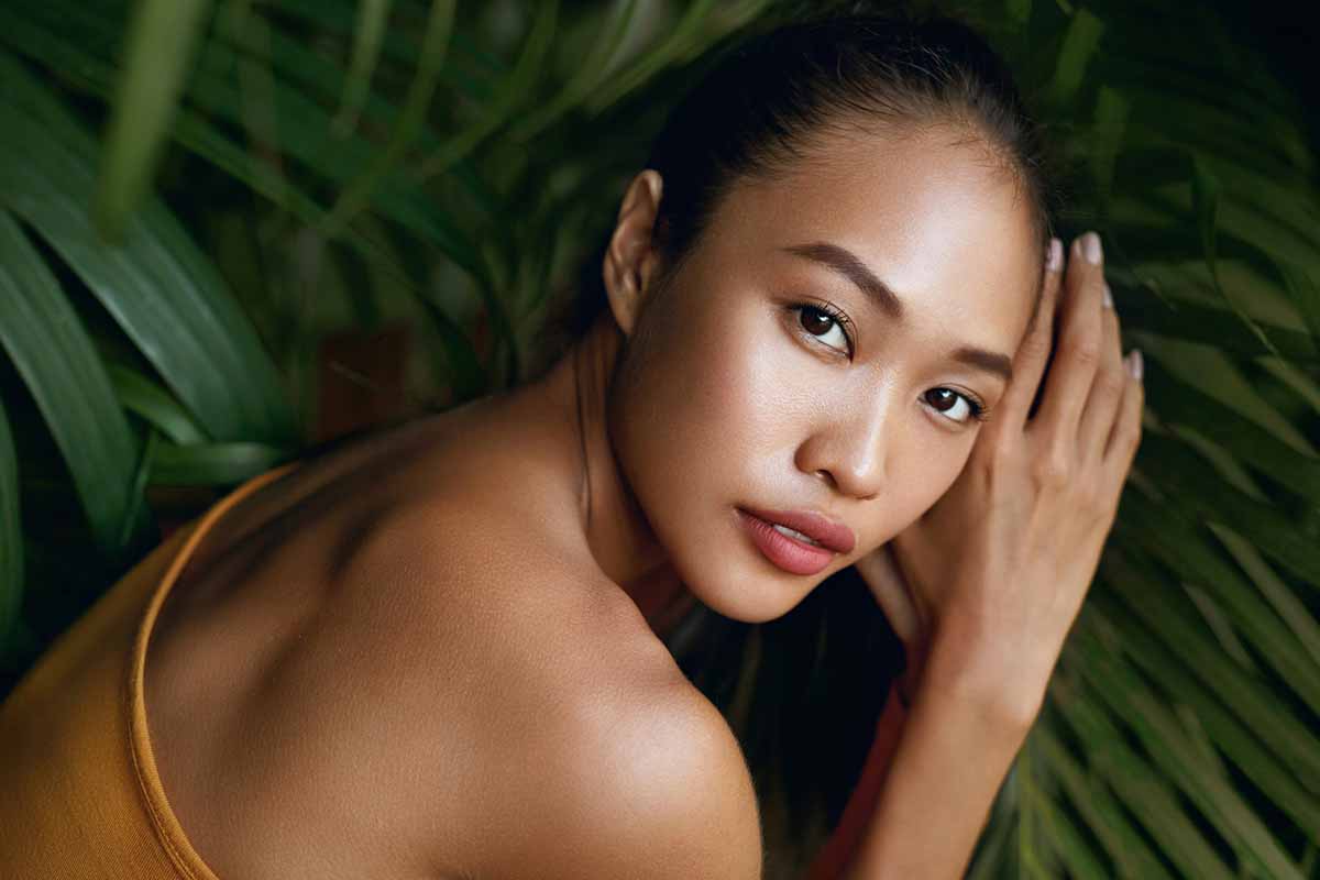 Woman with smooth facial contours after facial rejuvenation
