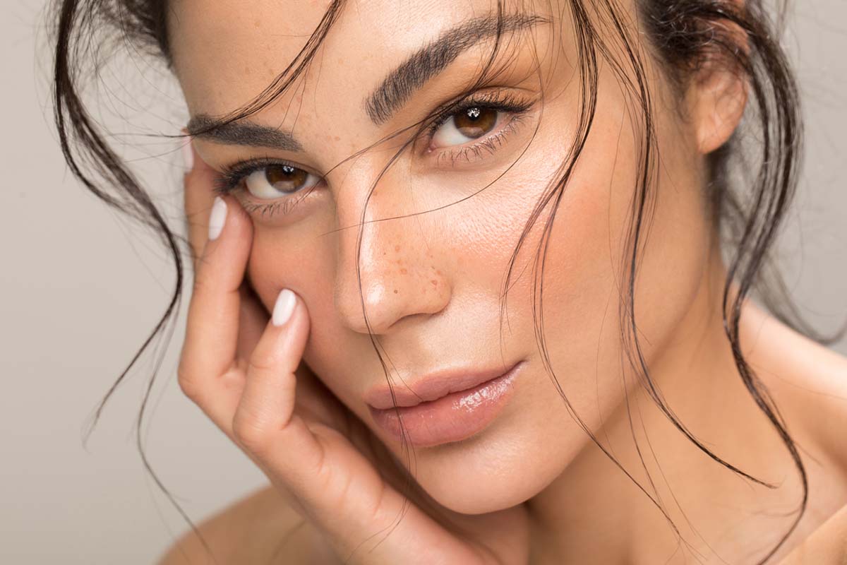 Woman receiving a Sculptra consultation for facial volume restoration